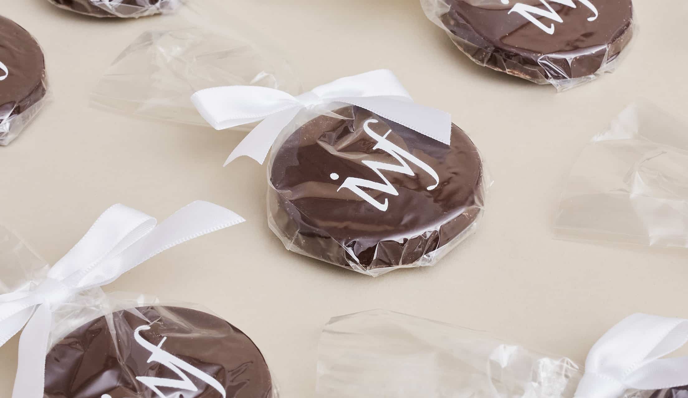Chocolate medallion wedding favors stamped with a custom logo
